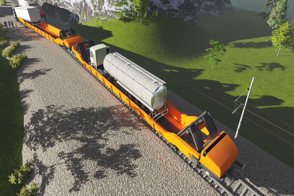Interwagon mobile tuckstop — a rail wagon platform with integrated ground-level loading ramps for transporting tank trucks and heavy vehicles